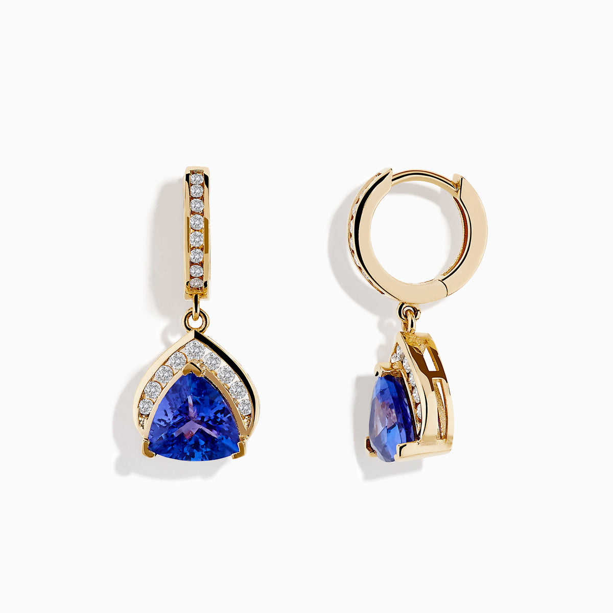 The Nahla Siri 14K Yellow Gold Trillion Tanzanite and Diamond Earrings feature triangular blue tanzanites framed by diamonds, with extra diamonds accenting the vertical gold bars above.