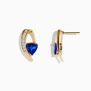 14K Yellow Gold Tanzanite and Diamond Drop Earrings featuring triangular blue tanzanite stones and a curved row of sparkling diamonds per earring, shown against a plain white background.
