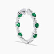 The 14K White Gold Emerald and Diamond Hoops showcase alternating round emeralds and diamonds in silver hoops, displayed against a white background.