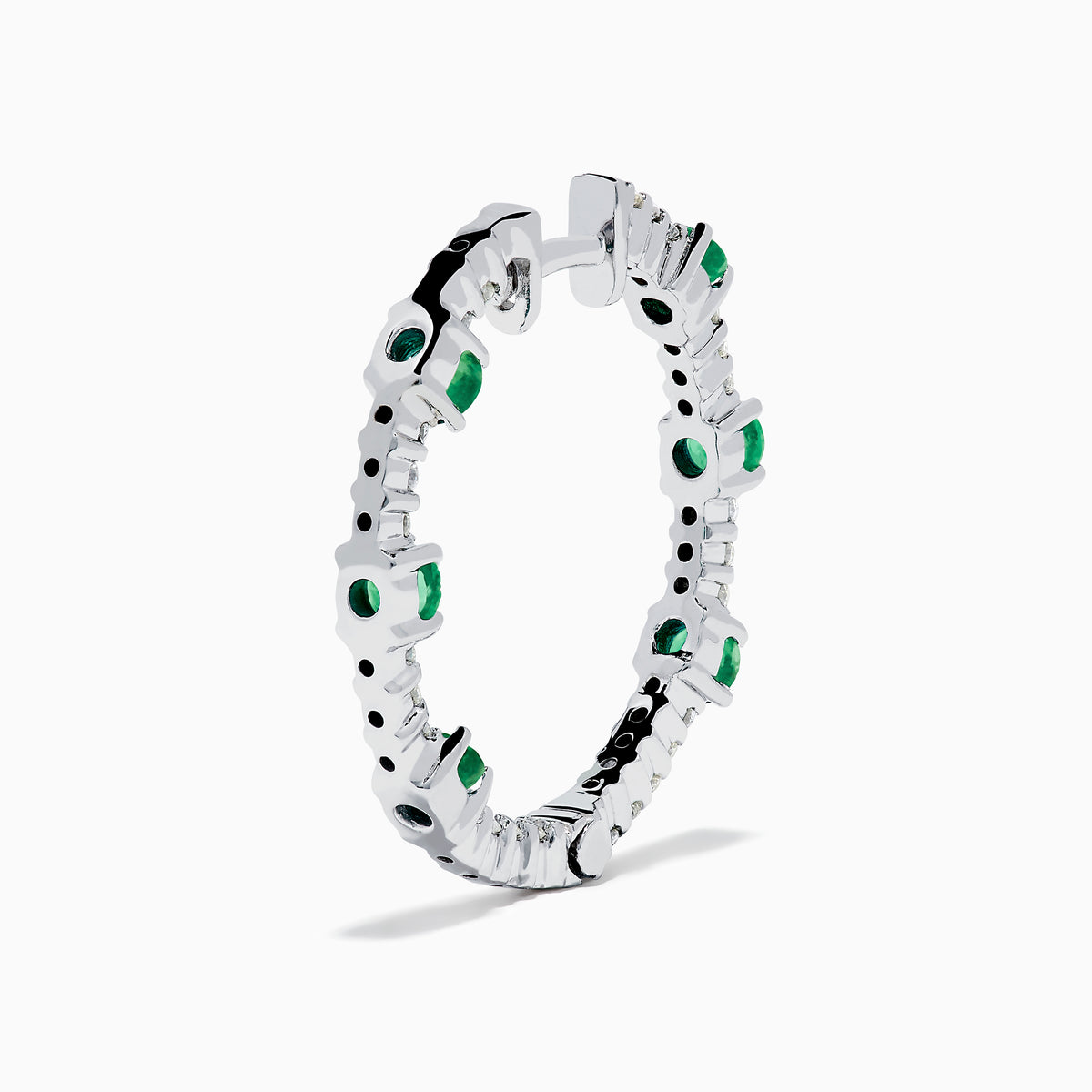 The 14K White Gold Emerald and Diamond Hoops showcase alternating round emeralds and diamonds in silver hoops, displayed against a white background.