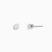 A pair of 14K White Gold Diamond Solitaire Stud Earrings, 0.75 TCW, featuring round sparkling diamonds in a classic prong setting against a plain white background.