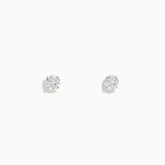 A pair of 14K Yellow Gold Diamond Solitaire Stud Earrings (0.75 TCW) are displayed against a white background.