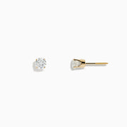 A pair of 14K Yellow Gold Diamond Solitaire Stud Earrings (0.75 TCW) are displayed against a white background.
