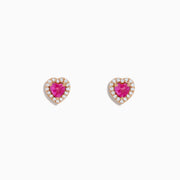 The Novelty 14K Rose Gold Pink Sapphire and Diamond Heart Earrings feature heart-shaped pink sapphires bordered by sparkling diamonds, displayed against a white background.