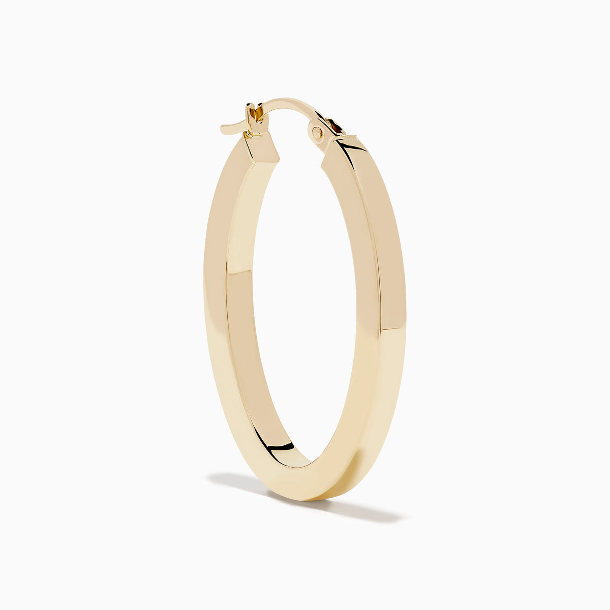 A pair of 14K Yellow Gold Square Tube Oval Hoop Earrings displayed vertically on a white background, casting soft shadows to the right.
