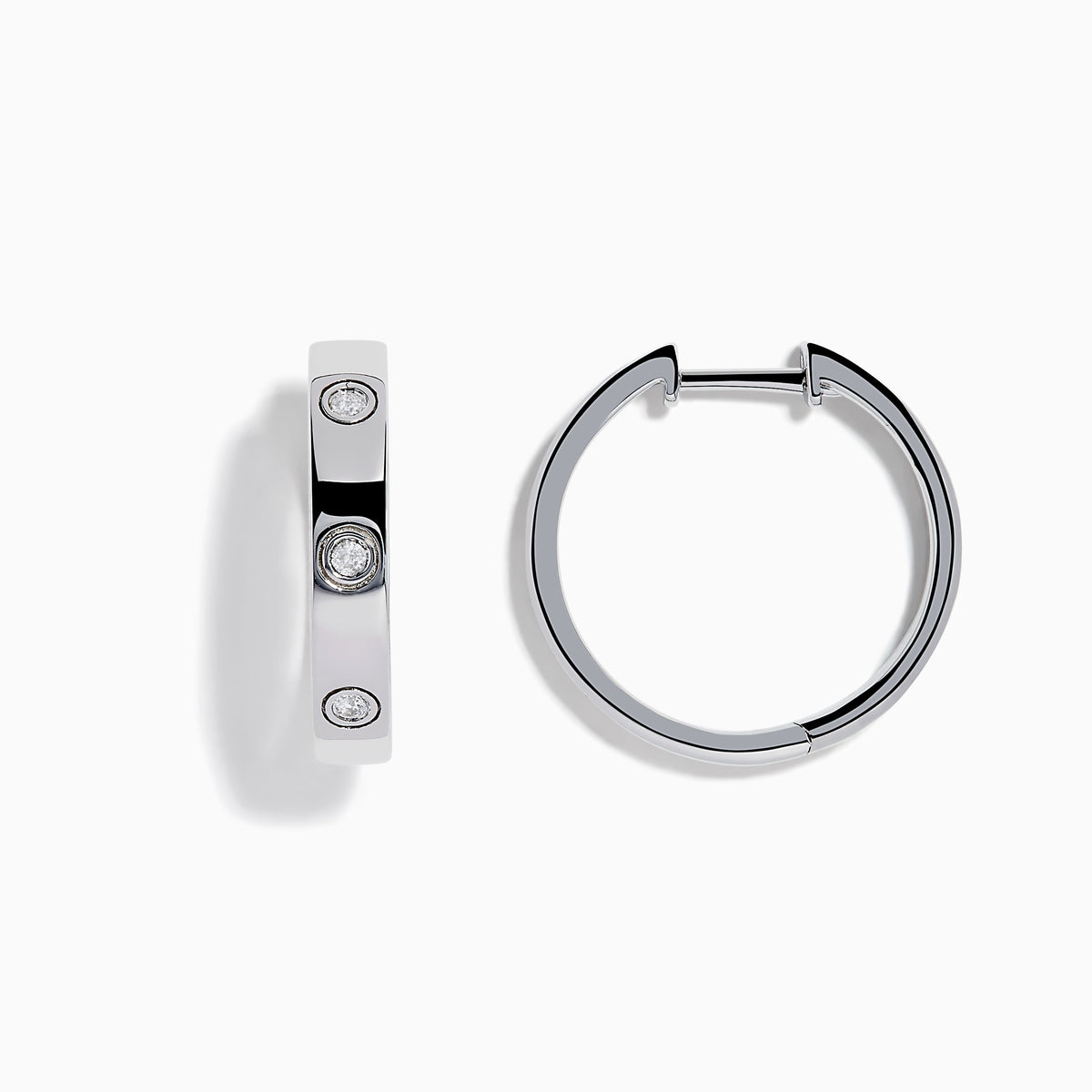 The 925 Sterling Silver Diamond Huggie Earrings feature three round diamonds set evenly along each polished hoop, shown against a white background.