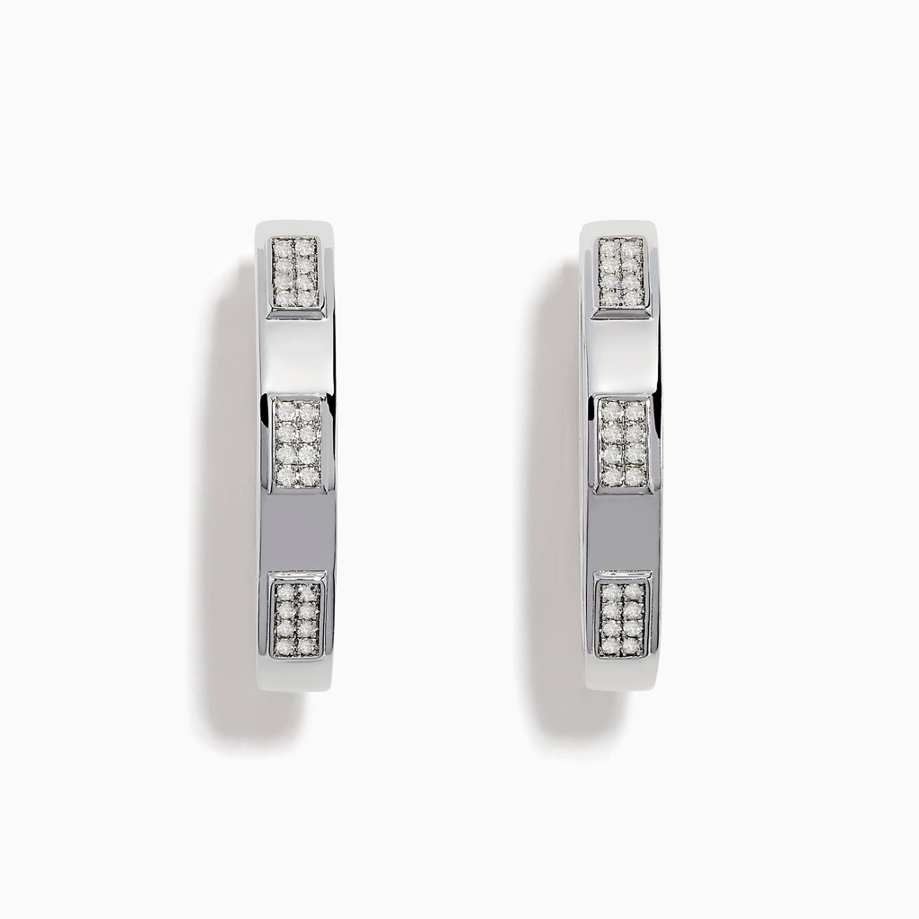 The 925 Sterling Silver Diamond Hoop Earrings feature rectangular sections with small, embedded clear stones, displayed on a plain white background.