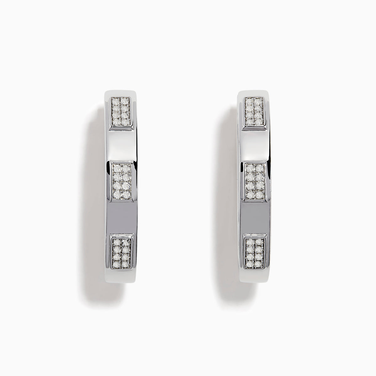 The 925 Sterling Silver Diamond Hoop Earrings feature rectangular sections with small, embedded clear stones, displayed on a plain white background.