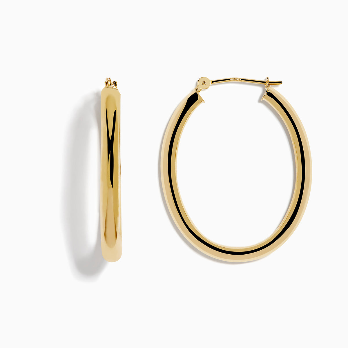 A pair of 14K Yellow Gold Hollow Oval Hoop Earrings displayed vertically on a white background, casting soft shadows to the right.