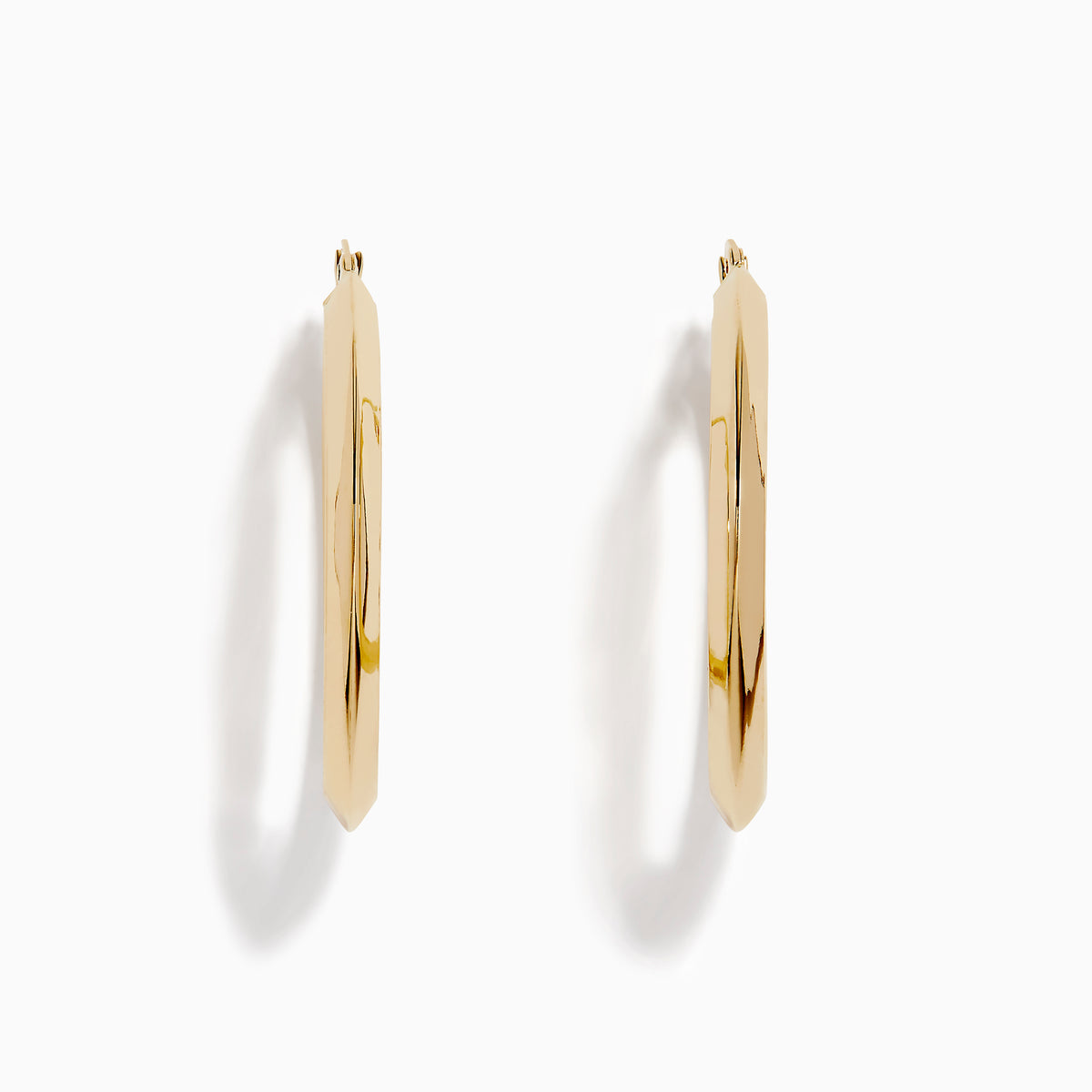 A pair of 14K Yellow Gold Rhombus Tube Hoop Earrings with a shiny, geometric shape, displayed on a white background.