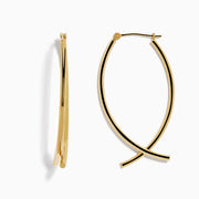 The 14K Yellow Gold Hollow Bypass Hoop Earrings feature two parallel strands in a sleek drop design with a smooth, shiny finish, elegantly displayed against a white background.