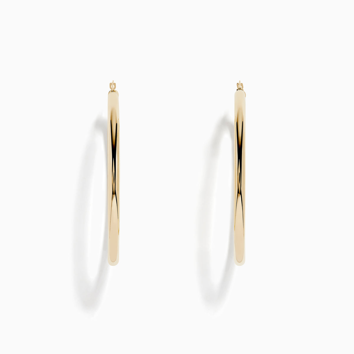 The 14K Yellow Gold Large Tube Hoop Earrings feature a simple, polished design, displayed on a plain white background with subtle shadows.