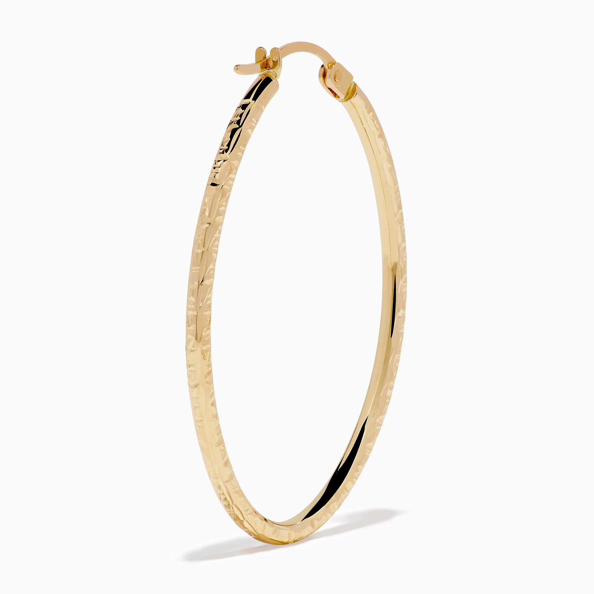 A pair of 14K Yellow Gold Oval Tube Baguette Cut Hoop Earrings, thin and textured, are displayed vertically with clasps at the top against a plain white background.