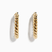 The 14K Yellow Gold Twisted Tube Hoops are shown on a white background, with gentle shadows highlighting their elegant design.