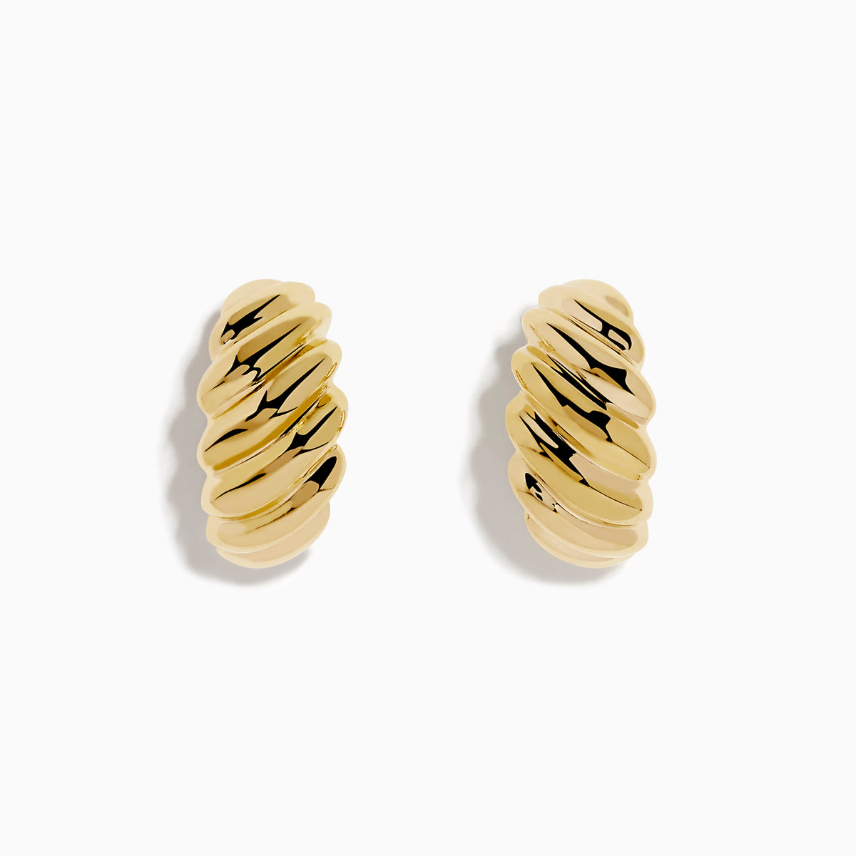 The 14K Yellow Gold Croissant Huggie Earrings feature an oval shape with a ridged, twisted design, shown on a white background.