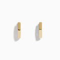 A pair of minimalist 14K Yellow Gold Hexagon Huggies displayed upright on a plain white background.