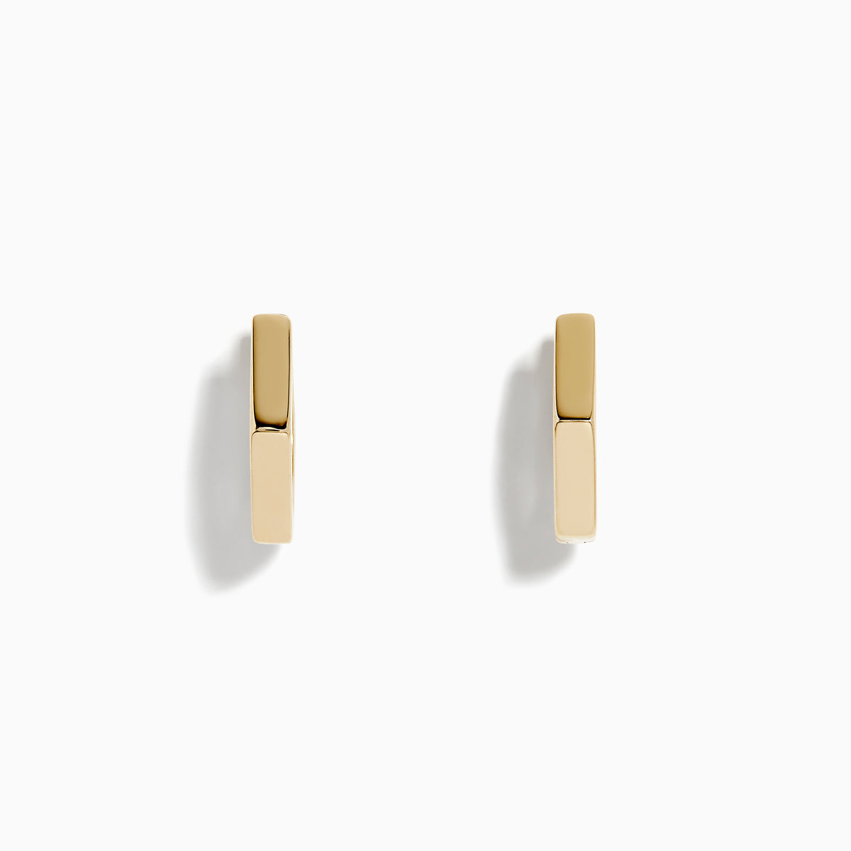 A pair of minimalist 14K Yellow Gold Hexagon Huggies displayed upright on a plain white background.