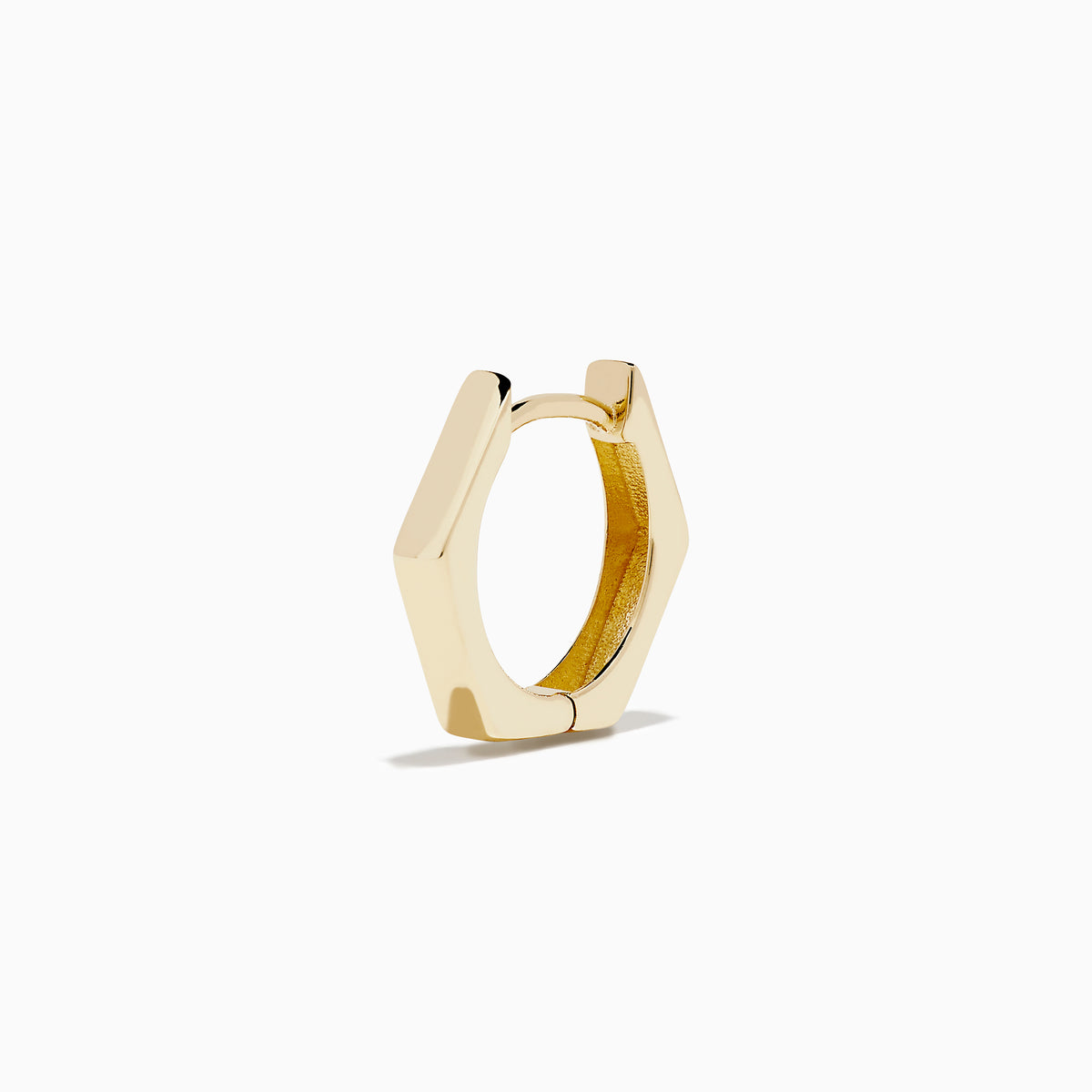 A pair of minimalist 14K Yellow Gold Hexagon Huggies displayed upright on a plain white background.