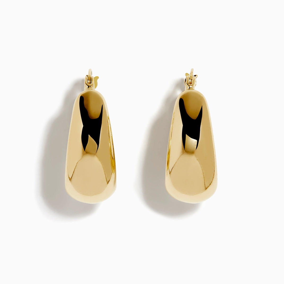 A pair of 14K yellow gold graduated oval chunky hoop earrings with a smooth, curved surface and clasp fastening, displayed on a white background.