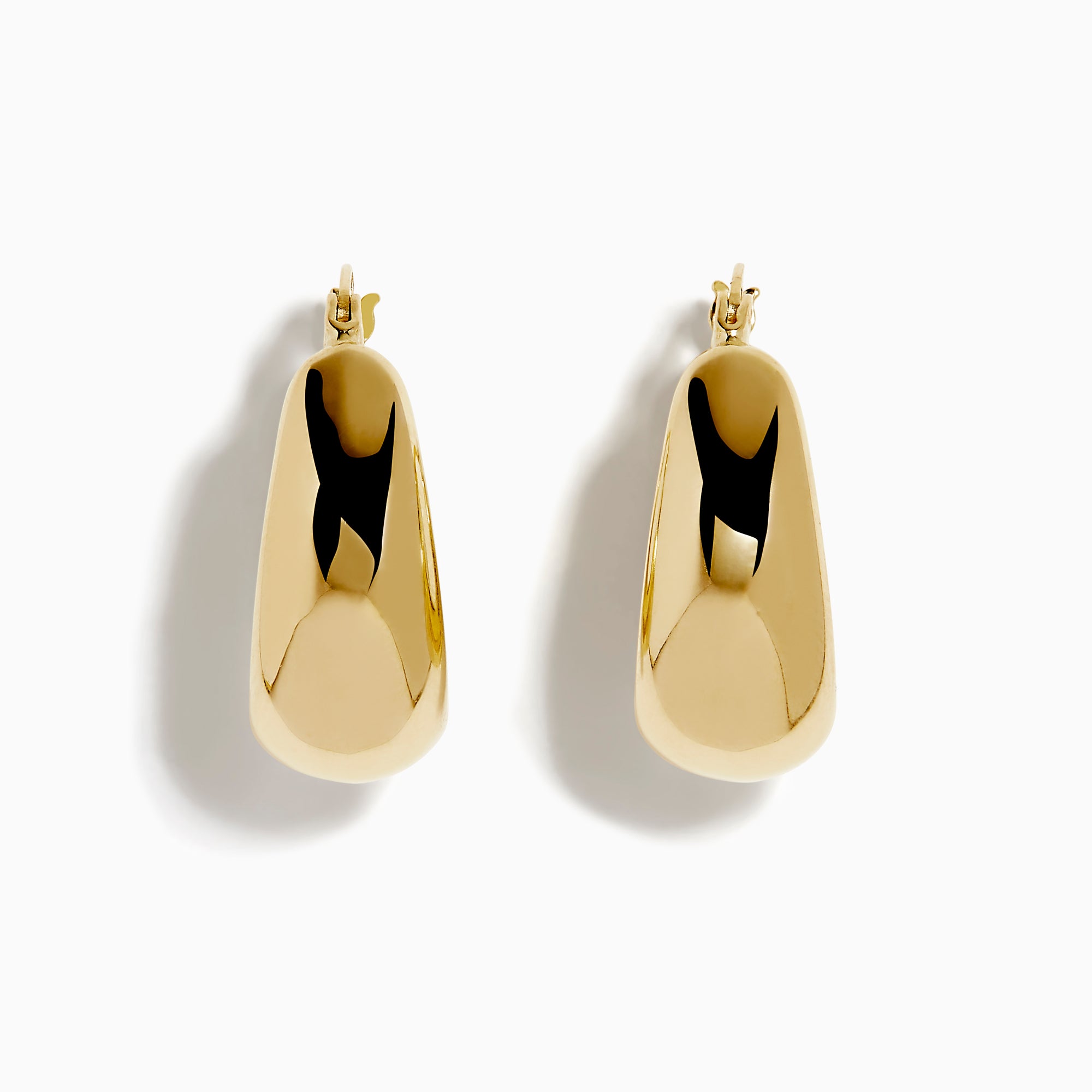 A pair of 14K yellow gold graduated oval chunky hoop earrings with a smooth, curved surface and clasp fastening, displayed on a white background.