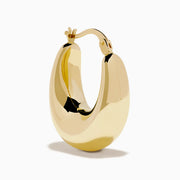 A pair of 14K yellow gold graduated oval chunky hoop earrings with a smooth, curved surface and clasp fastening, displayed on a white background.