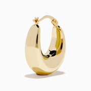 A pair of 14K yellow gold graduated oval chunky hoop earrings with a smooth, curved surface and clasp fastening, displayed on a white background.