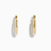 The 14K Yellow Gold Geometric Hoops feature a faceted, hexagonal design and are shown upright against a plain white background.