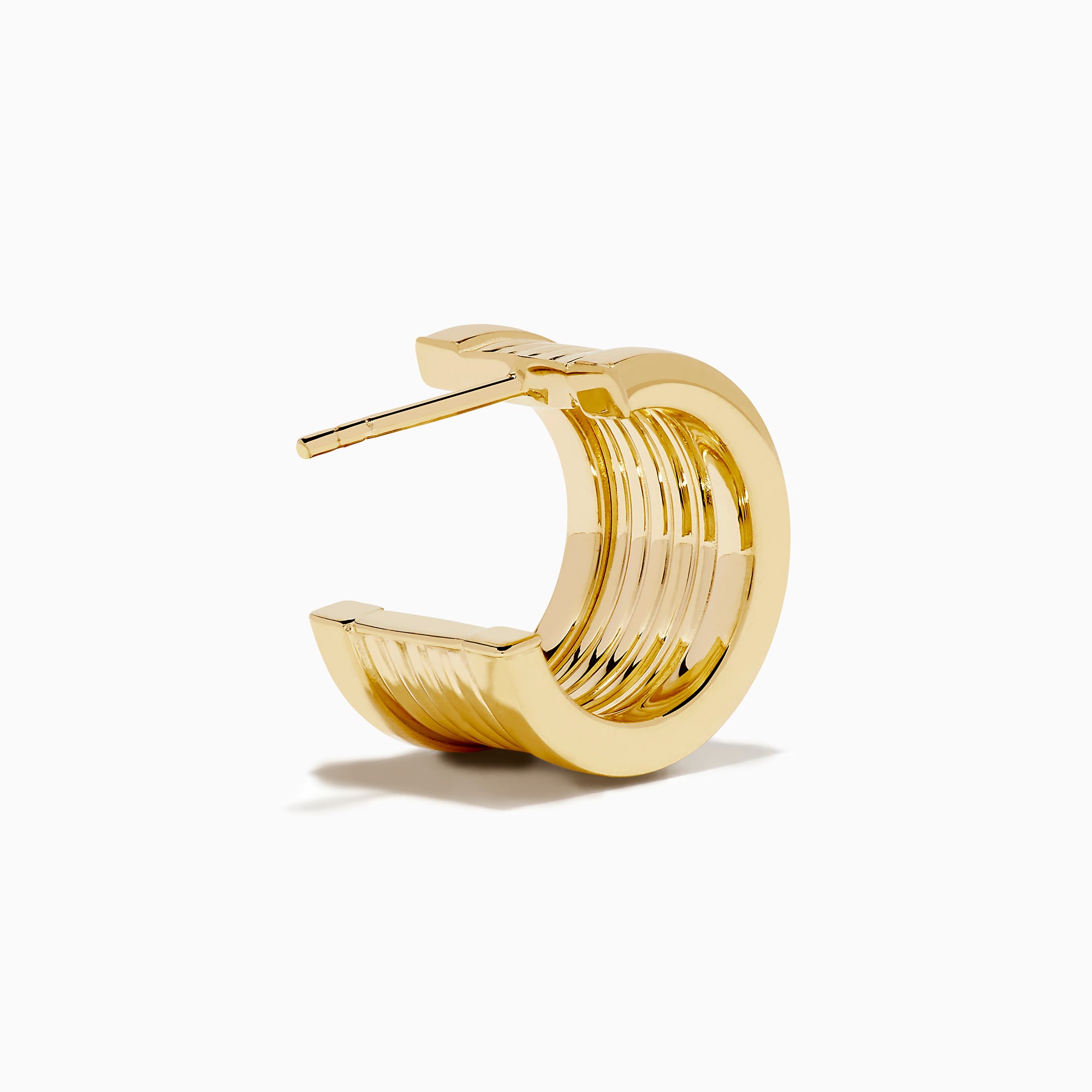 The 14K Yellow Gold Chunky Huggie Earrings feature a ridged, cylindrical design and are shown against a white background.