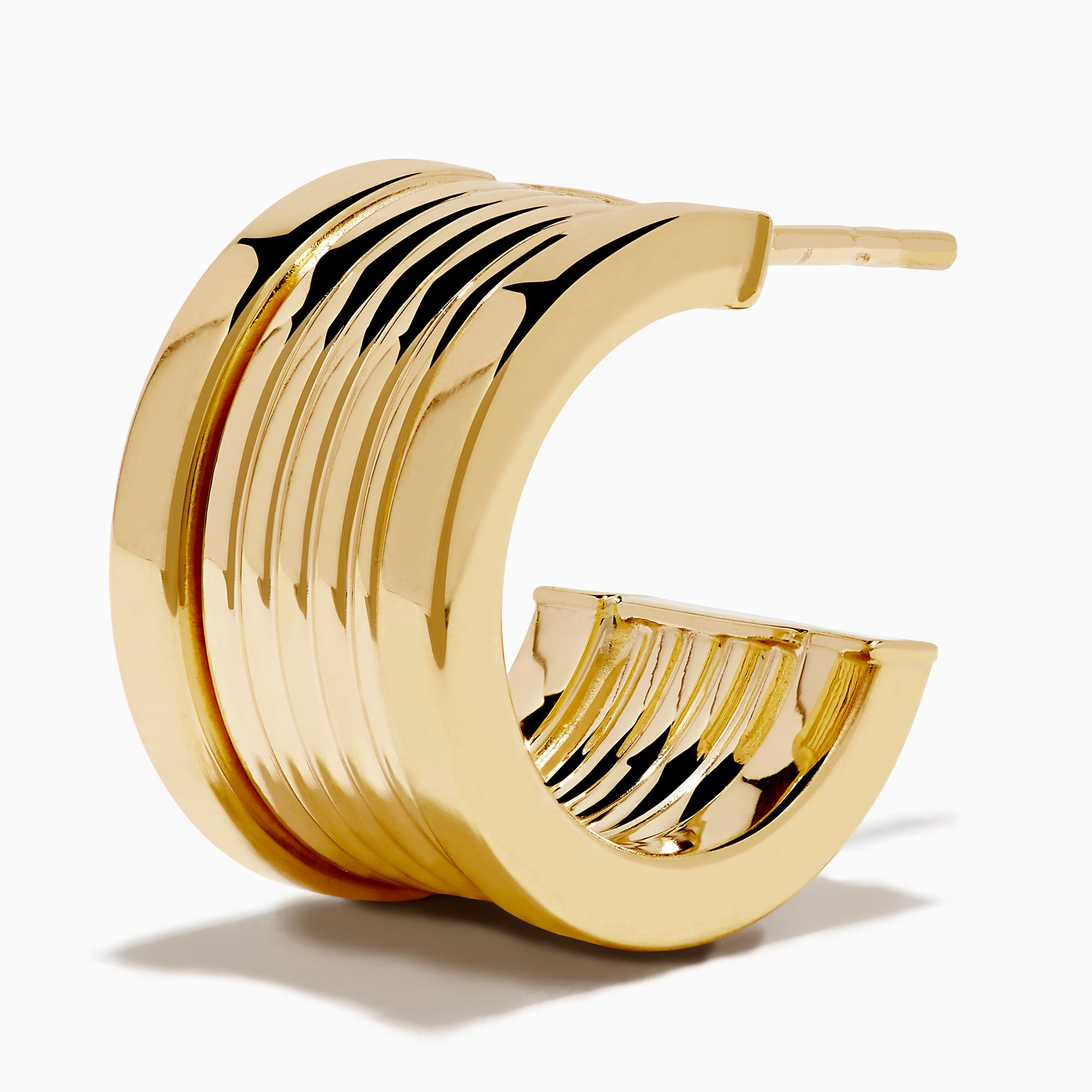 The 14K Yellow Gold Chunky Huggie Earrings feature a ridged, cylindrical design and are shown against a white background.