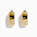 The 14K Yellow Gold Rectangular Bold Huggie Earrings feature smooth, polished surfaces and a shiny finish, shown against a plain white background.
