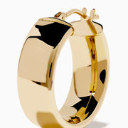 The 14K Yellow Gold Tube Hoop Earrings feature a rectangular shape and smooth, polished finish, shown against a white background.