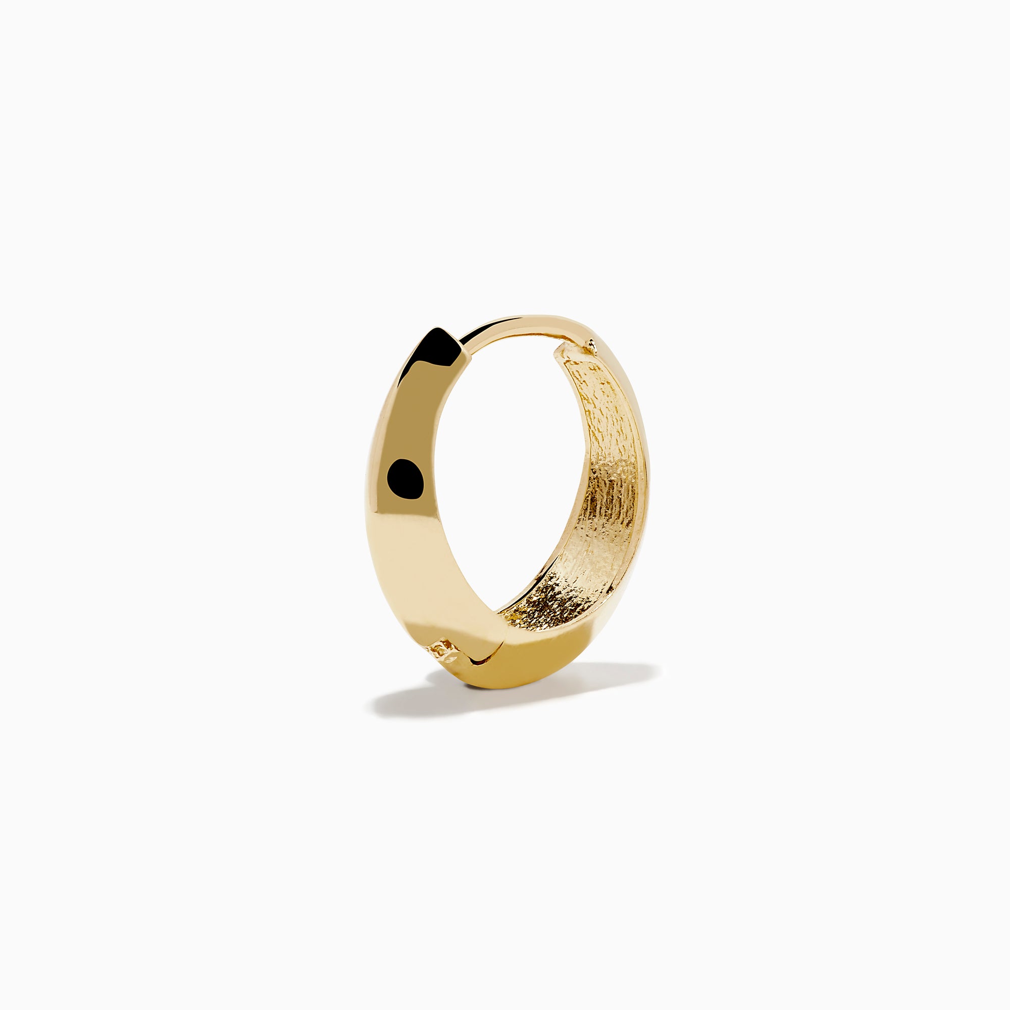 The 14K Yellow Gold Knife Edge Huggie Earrings feature a small, geometric design with sleek angles, shown against a plain white background.