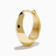 The 14K Yellow Gold Knife Edge Huggie Earrings feature a small, geometric design with sleek angles, shown against a plain white background.