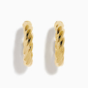 The 14K Yellow Gold Twist Hoop Earrings are shown against a white background, with soft shadows cast to the left.