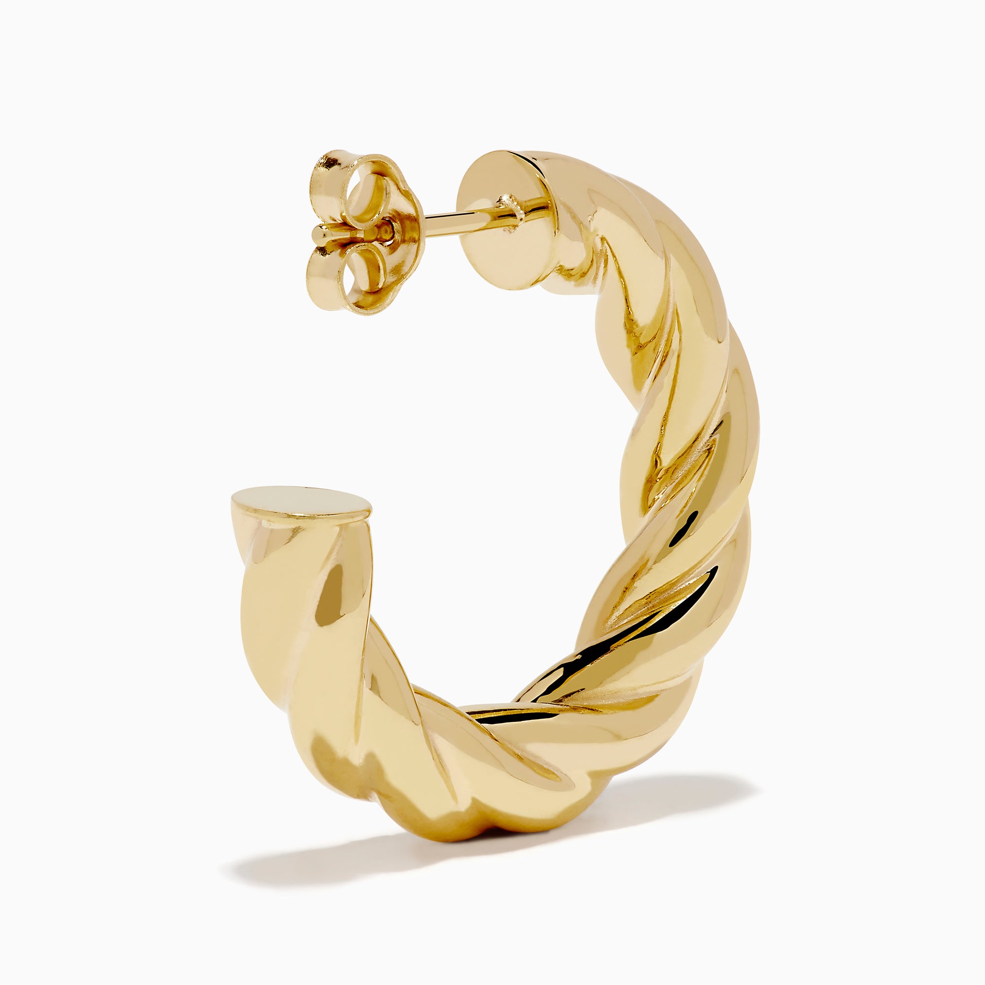 The 14K Yellow Gold Twist Hoop Earrings are shown against a white background, with soft shadows cast to the left.