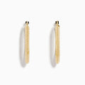 A pair of 14K Yellow Gold Knife Edge Tube Hoop Earrings with a textured finish, displayed on a plain white background and shown facing forward with visible clasps at the top.