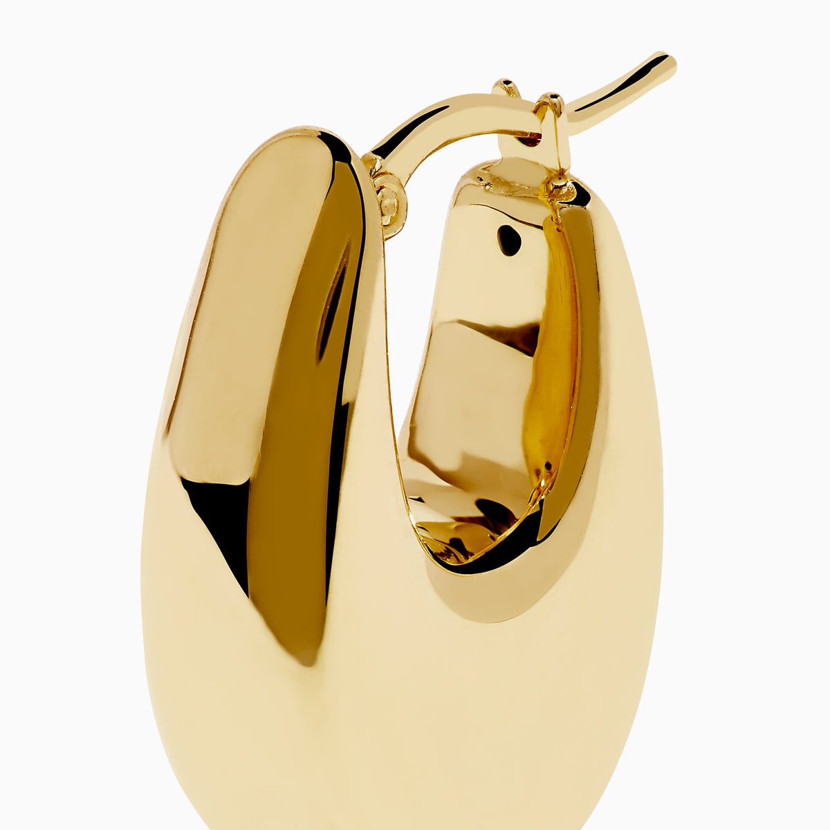 The 14 Karat Yellow Gold Chunky Oval Hoop Earrings feature a shiny finish and smooth, rounded edges, shown against a white background.