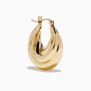 The 14K Yellow Gold Shrimp Hoop Earrings feature a twisted, sculptural teardrop design and are displayed on a white background.