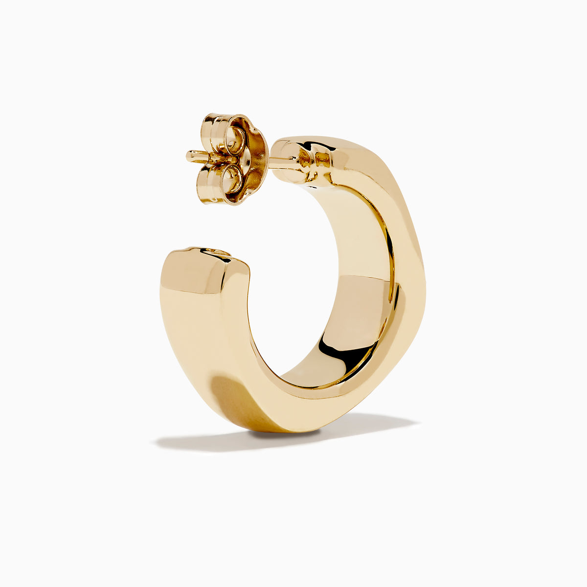 A pair of 14K Yellow Gold Hoop Earrings is shown vertically on a white background, casting soft shadows to the left.