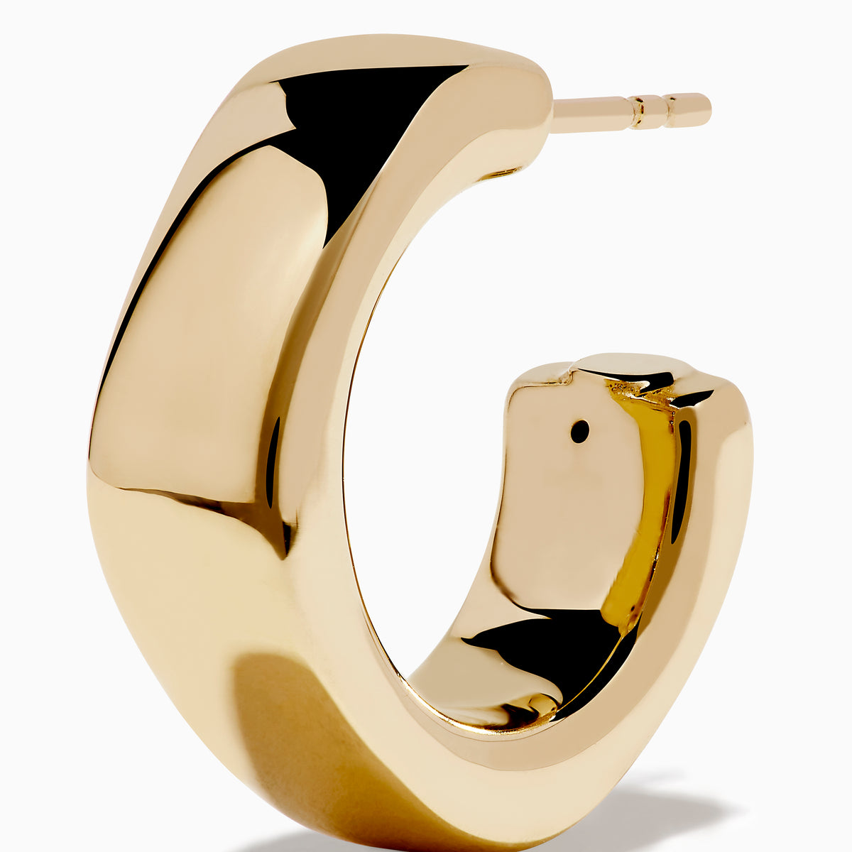 A pair of 14K Yellow Gold Hoop Earrings is shown vertically on a white background, casting soft shadows to the left.