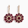 The 14K Rose Gold Rhodolite and Diamond Floral Dangle Earrings showcase large floral designs with deep red rhodolite gemstone petals, accented by clear stones and a diamond circle at the center.