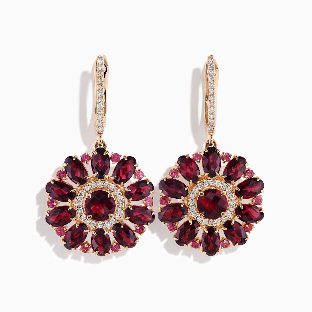 The 14K Rose Gold Rhodolite and Diamond Floral Dangle Earrings showcase large floral designs with deep red rhodolite gemstone petals, accented by clear stones and a diamond circle at the center.