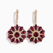 The 14K Rose Gold Rhodolite and Diamond Floral Dangle Earrings showcase large floral designs with deep red rhodolite gemstone petals, accented by clear stones and a diamond circle at the center.