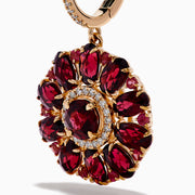 The 14K Rose Gold Rhodolite and Diamond Floral Dangle Earrings showcase large floral designs with deep red rhodolite gemstone petals, accented by clear stones and a diamond circle at the center.
