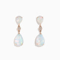 The 14K Rose Gold Opal and Diamond Drop Earrings feature pear-shaped opals and round diamond accents set in rose gold, offering a delicate, shimmering look against a white background.