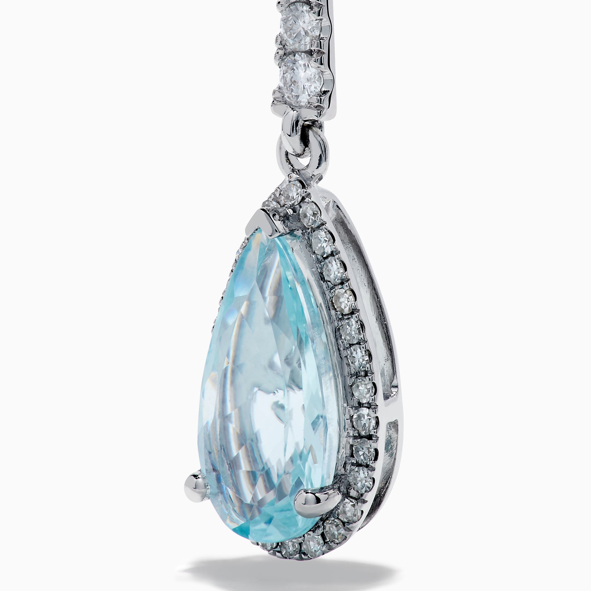 Elegant 14K white gold linear drop earrings featuring teardrop-shaped aquamarine gemstones, accented with diamonds.
