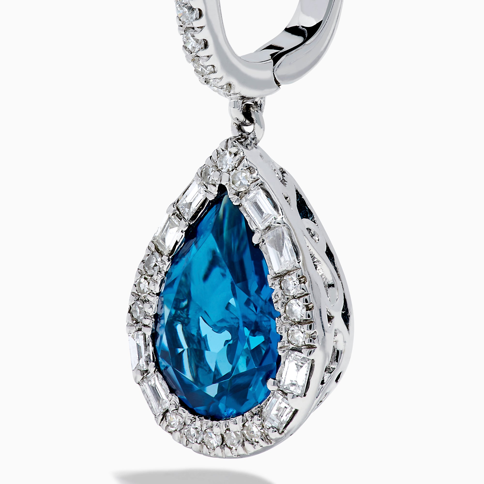 Elegant 14K white gold dangle earrings showcasing teardrop blue topaz gemstones, accented with sparkling diamonds for a stunning look.