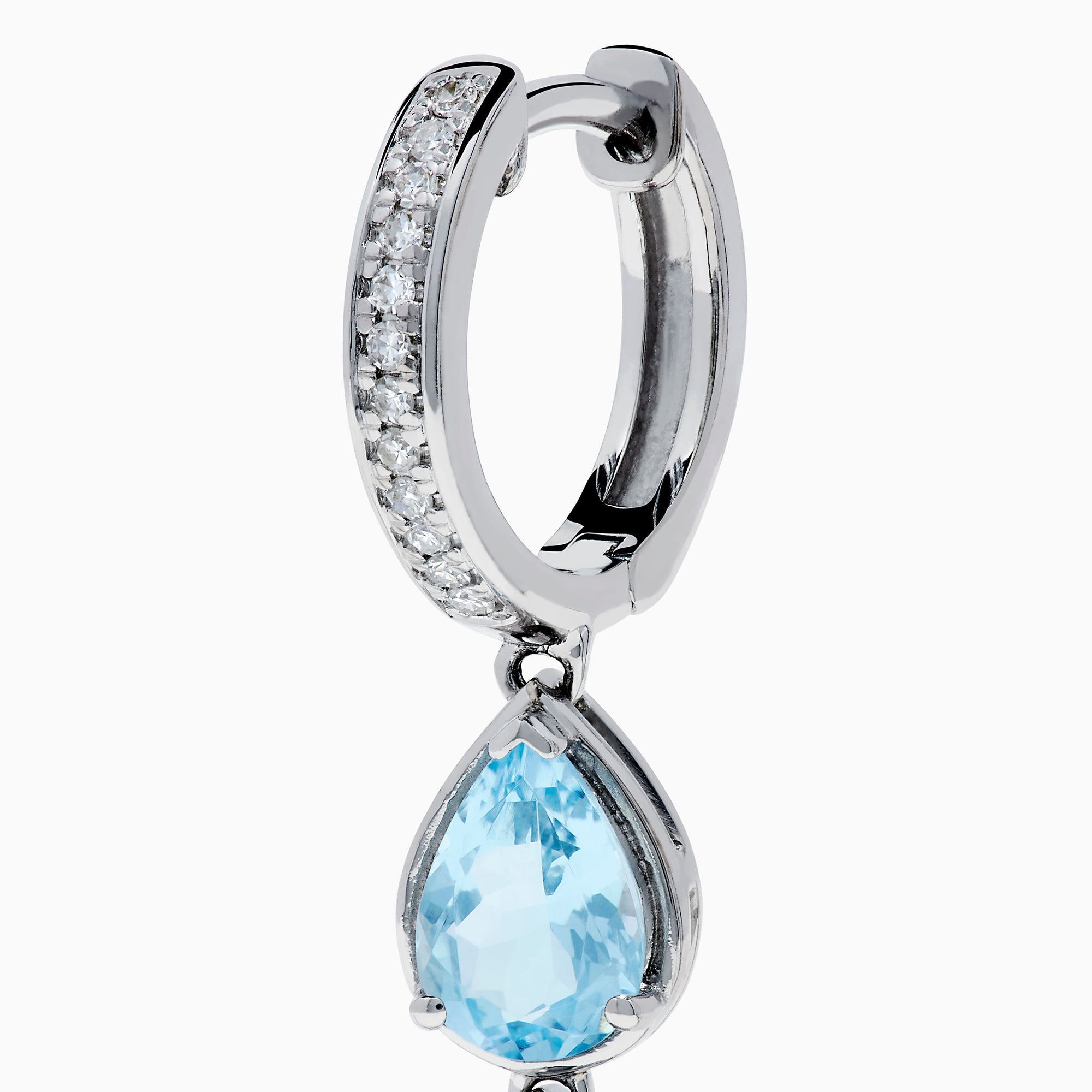 The 14K White Gold Aquamarine and Diamond Pear Shaped Linear Drop Earrings feature three vertically arranged pear-shaped aquamarines and diamond accents for extra sparkle.