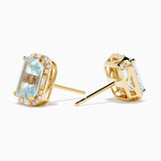 Aquarius 14K Yellow Gold Aquamarine and Diamond Earrings, each with a rectangular emerald-cut aquamarine framed by small round diamonds, shown on a plain white background.