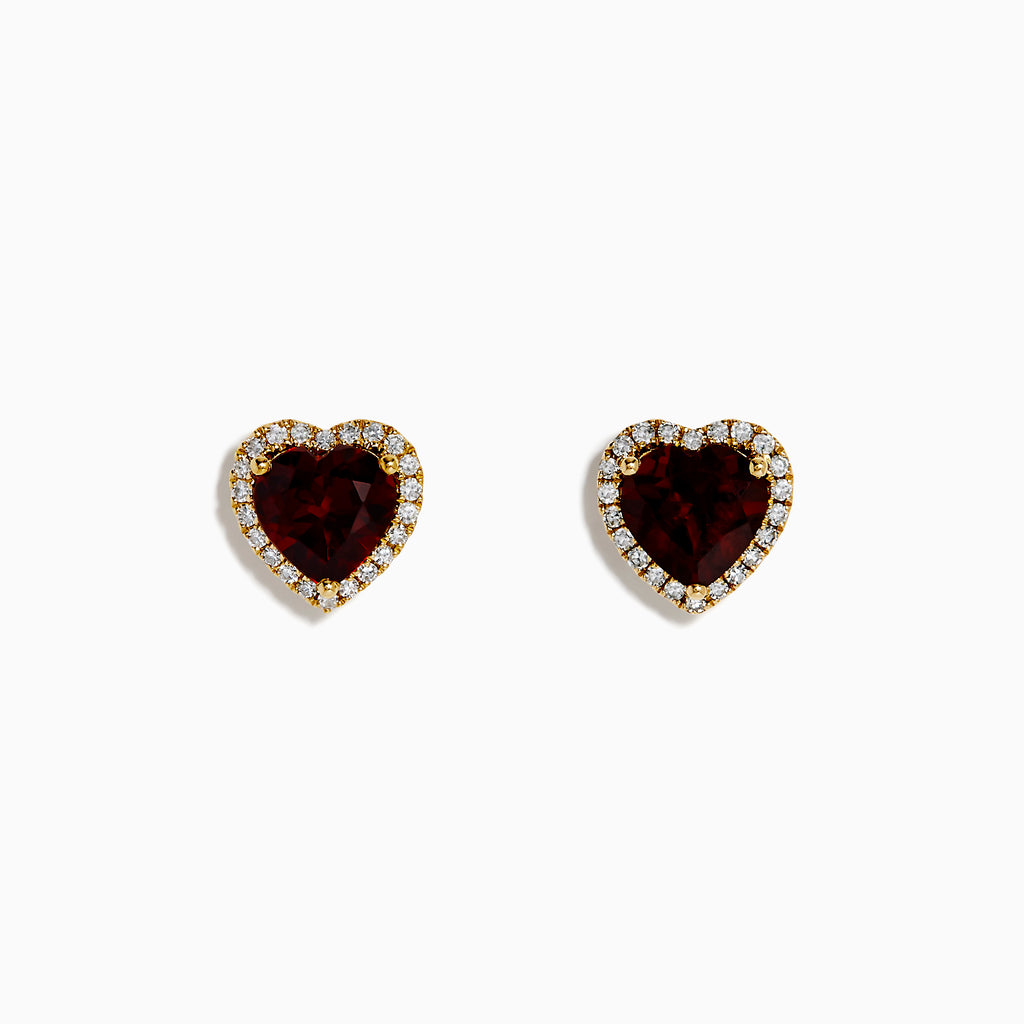The 14K Yellow Gold Garnet and Diamond Halo Heart Stud Earrings feature deep red heart-shaped garnets at the center, each surrounded by a sparkling diamond halo, all set in yellow gold.